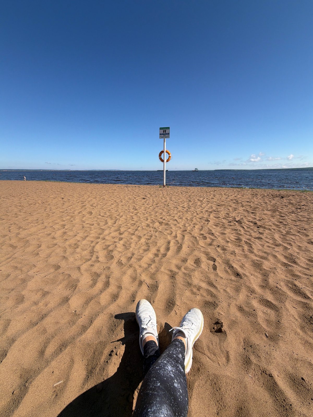 Woman practices early morning yoga on Chaikovsky beach boardwalk