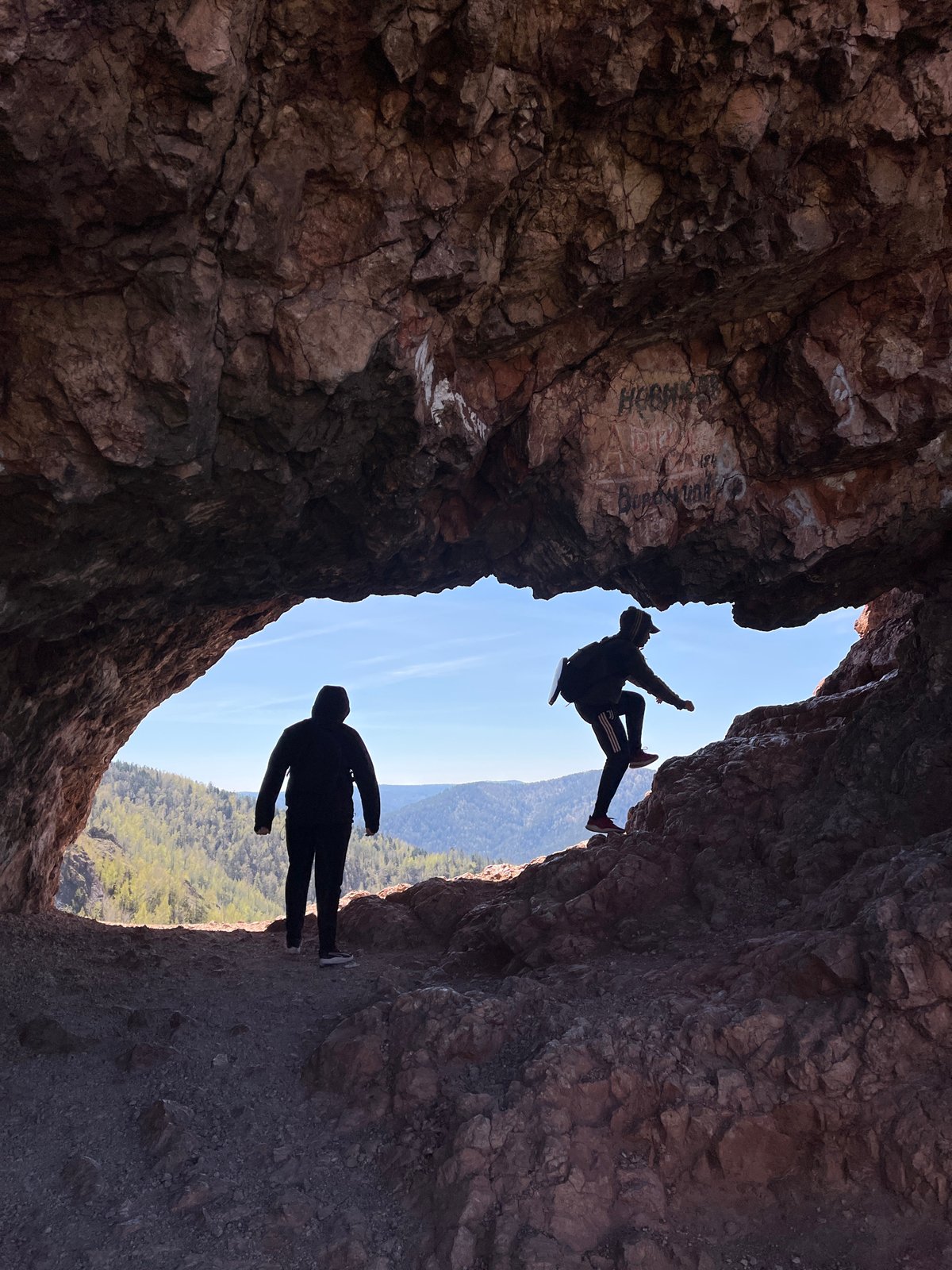 Tourists explore Tsar-Vrata rock formations near Krasnoyarsk
