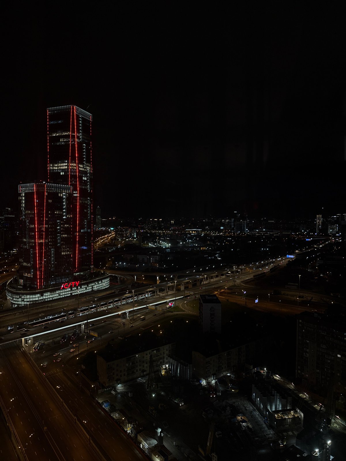 Nighttime aerial footage captures illuminated ICITY complex in Khimki