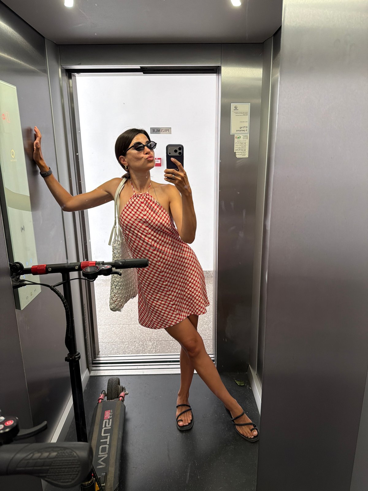Elevator selfie session with a scooter in tow