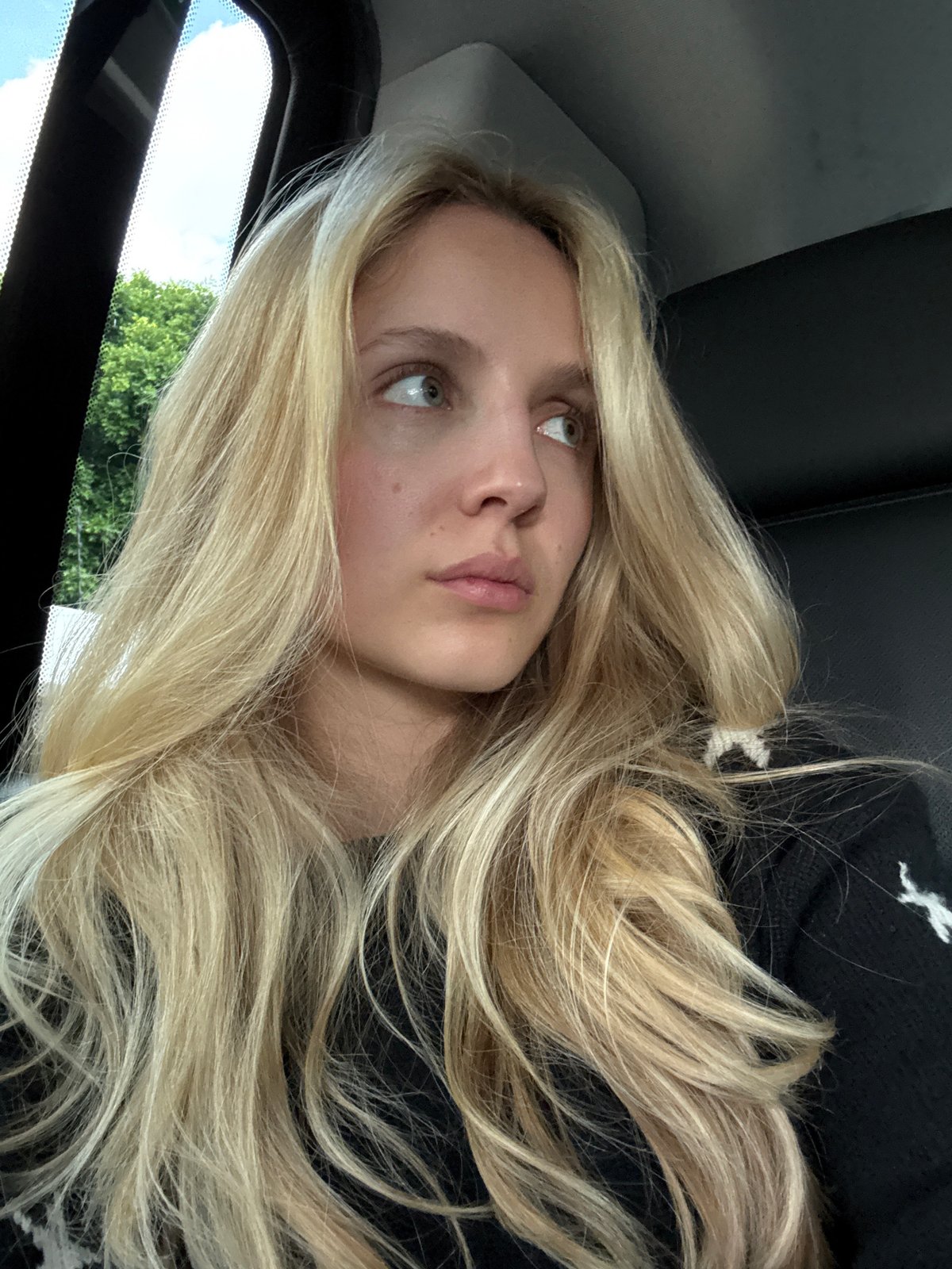 Riding through Mexico City at night, star-print sweater, back seat views