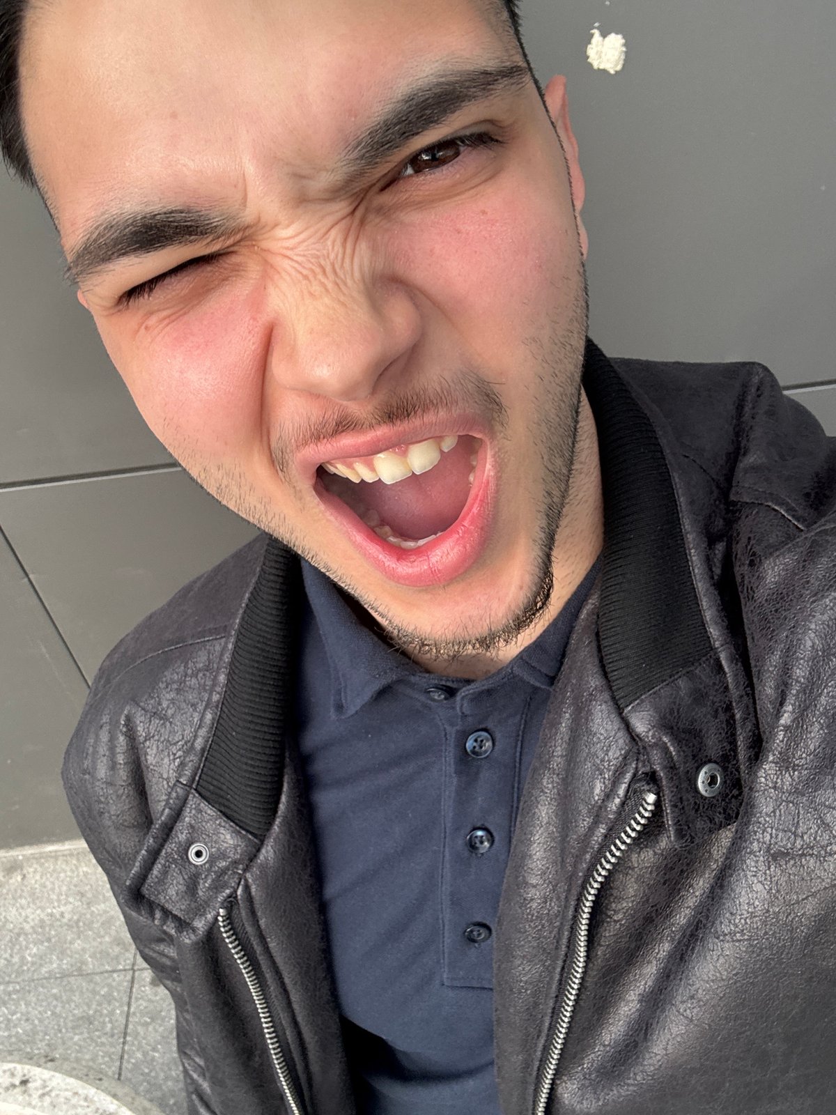 Man captures exaggerated selfie expression in Sofia