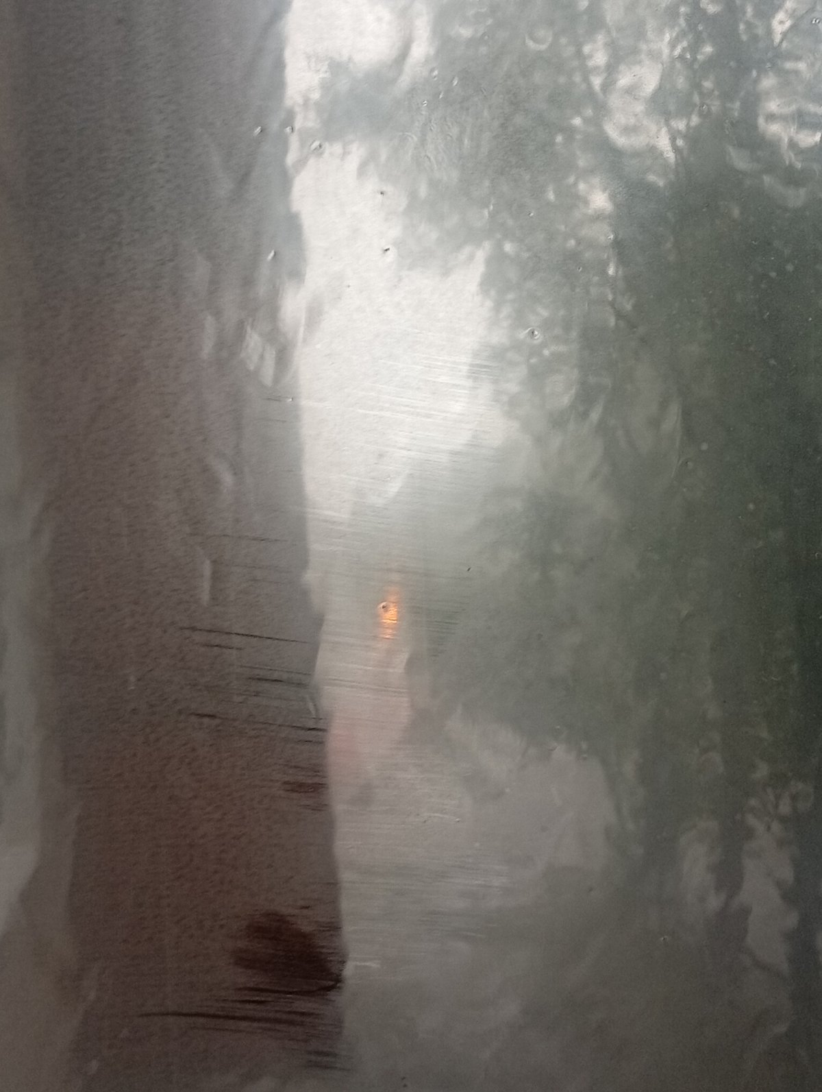 Heavy rain rolls through Minusinsk on a gray July morning