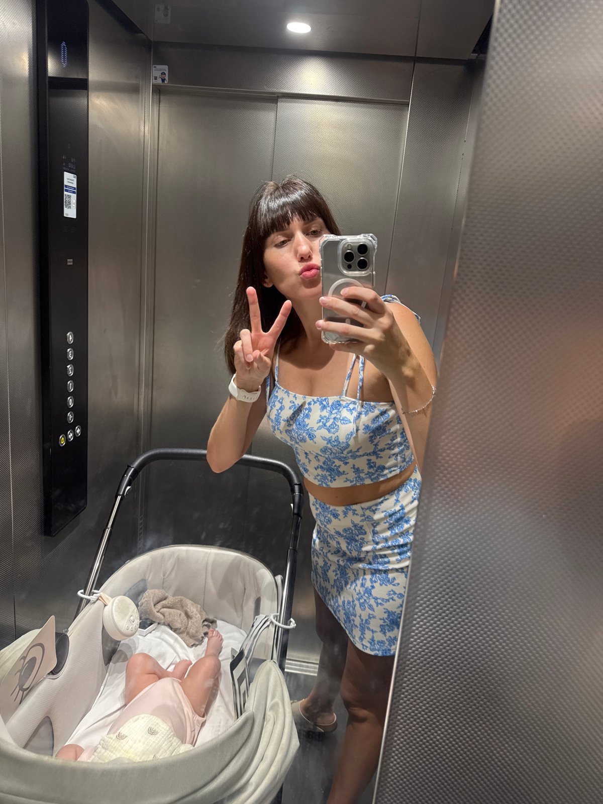 Quick stop in a modern Sicilian building, elevator selfies and a stroller