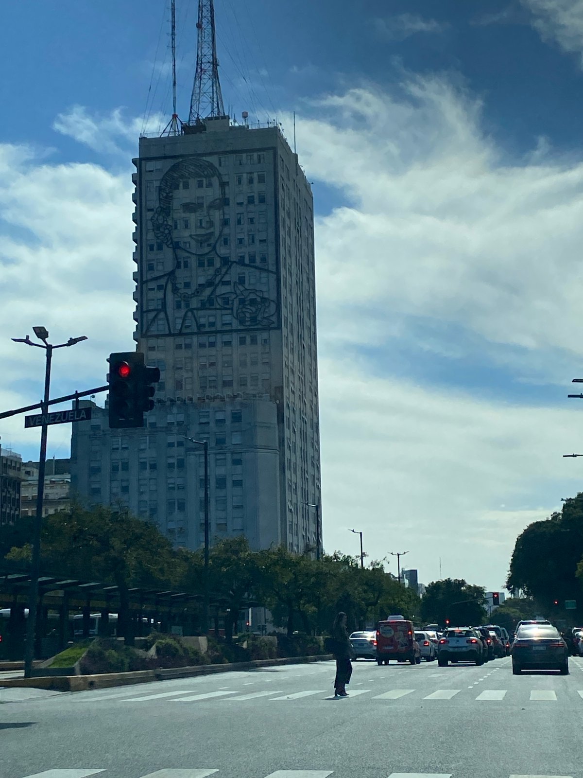 Street scenes documented in Buenos Aires featuring mural, trees
