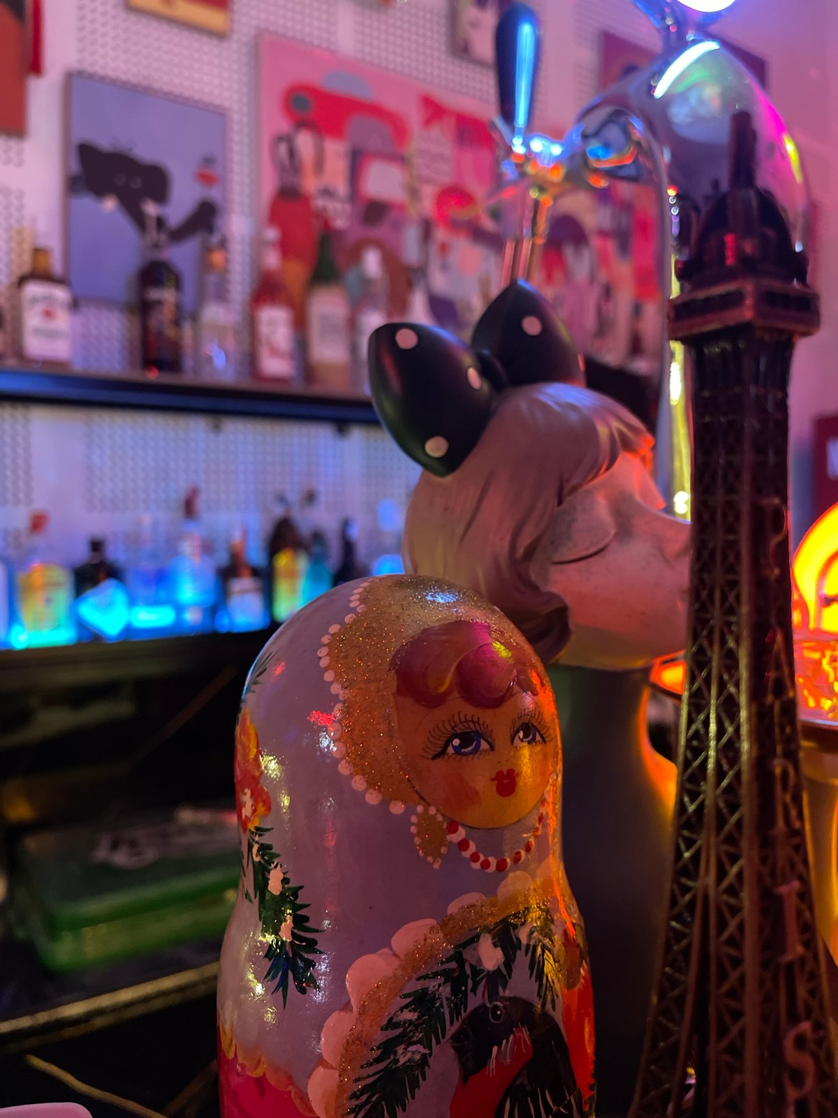 Inside a neon-lit bar in Đà Nẵng on a July night