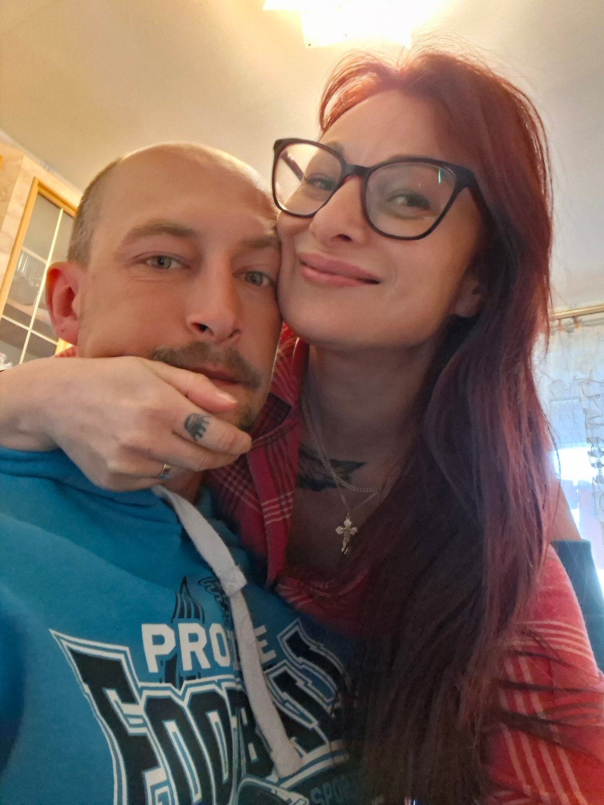 Couple takes indoor selfie at unknown location