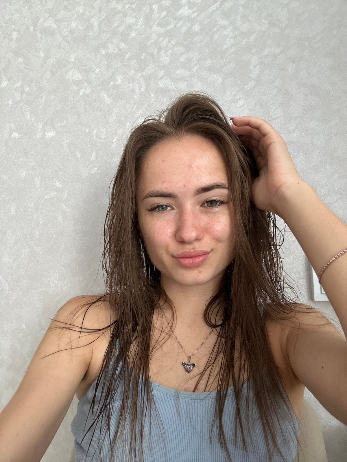 Post-shower selfie series, same wall, different poses