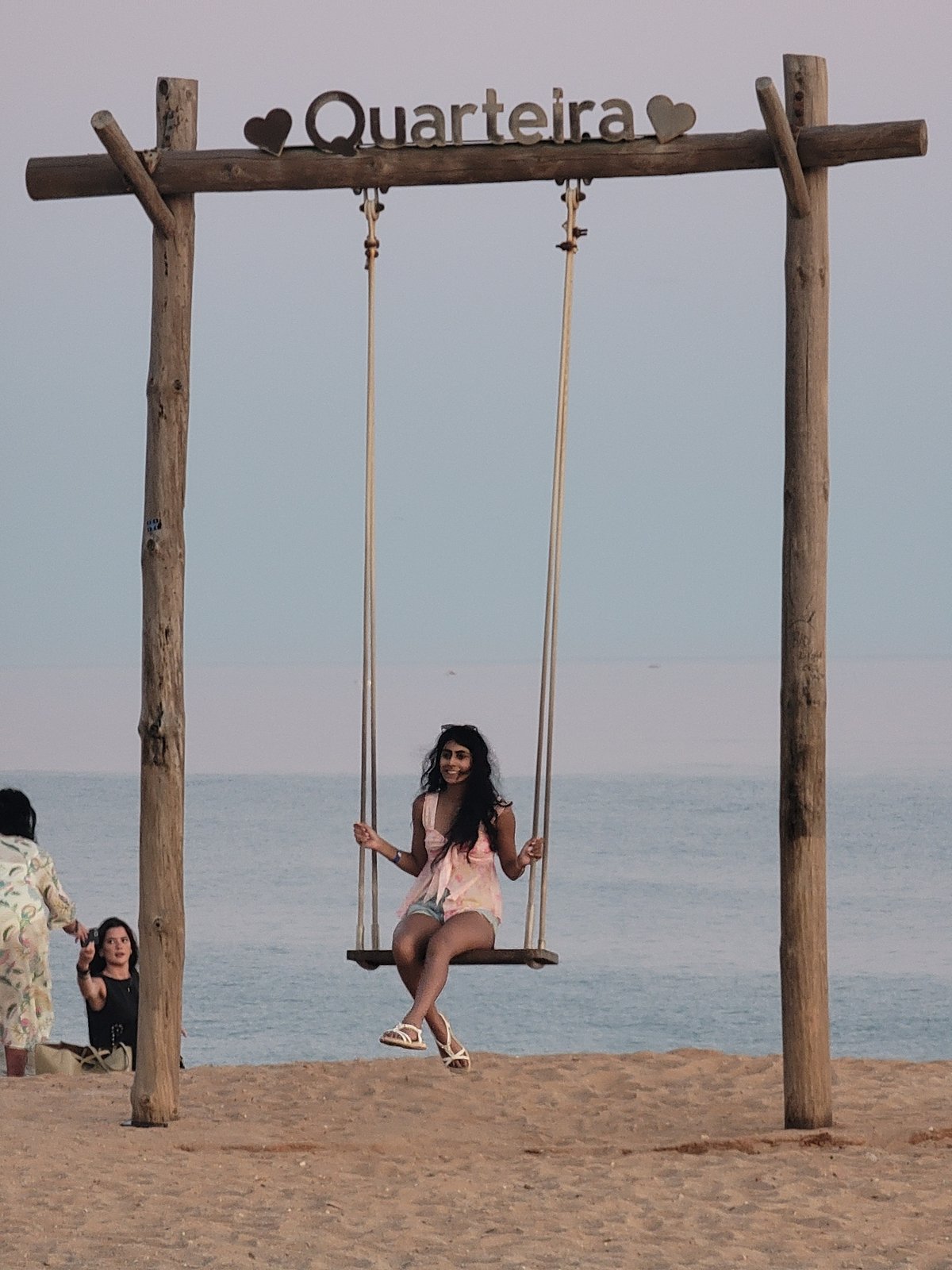 Hanging out at Quarteira's beachside swing on a summer evening