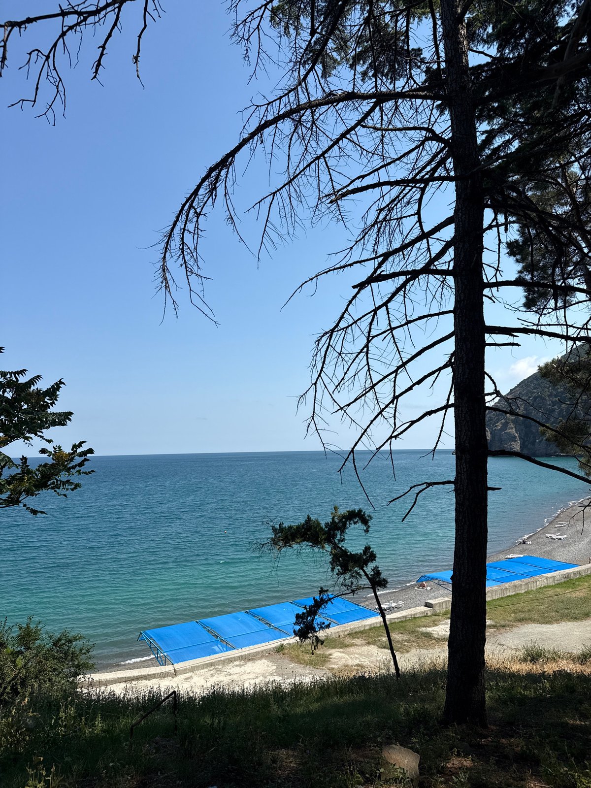 Sunny afternoon walk along Partenit's coastal promenade