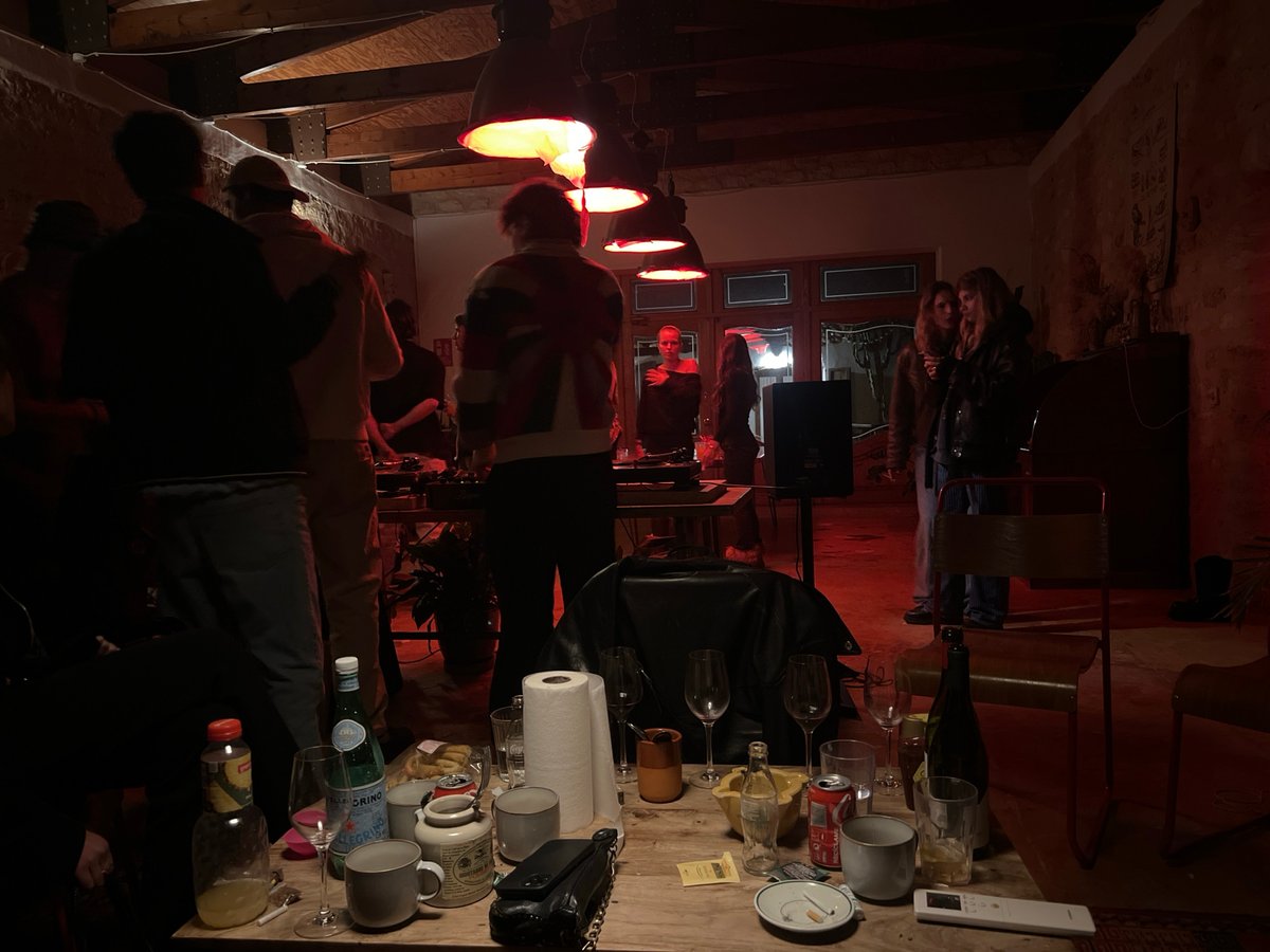 Evening gathering captured in dimly lit Spanish residence