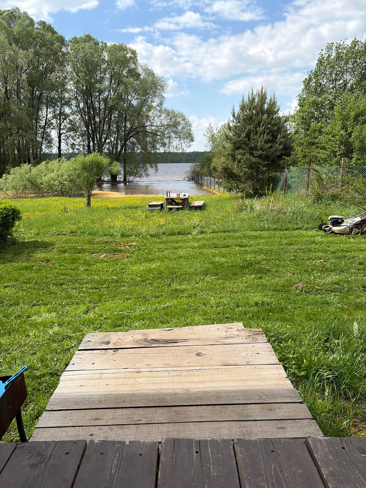 Lakeside property maintenance documented in rural Russia