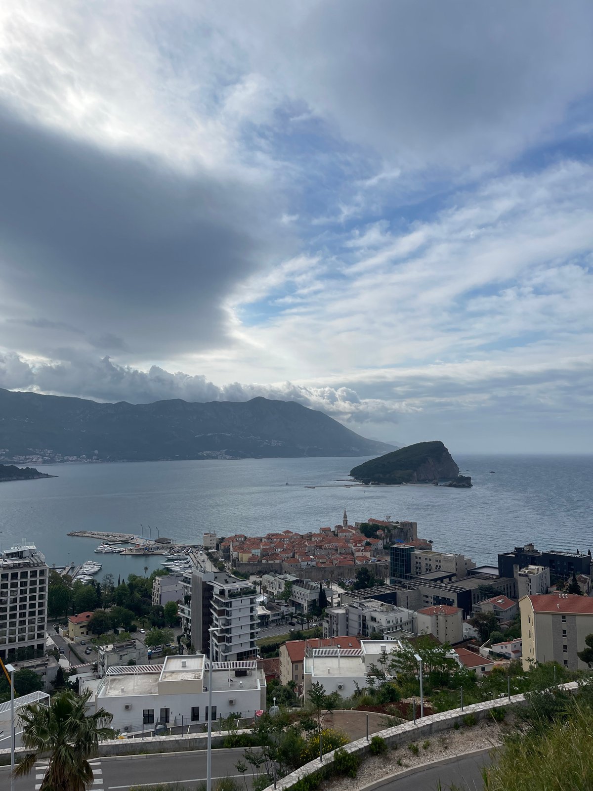 Aerial view captures Budva's historic coastline and red roofs