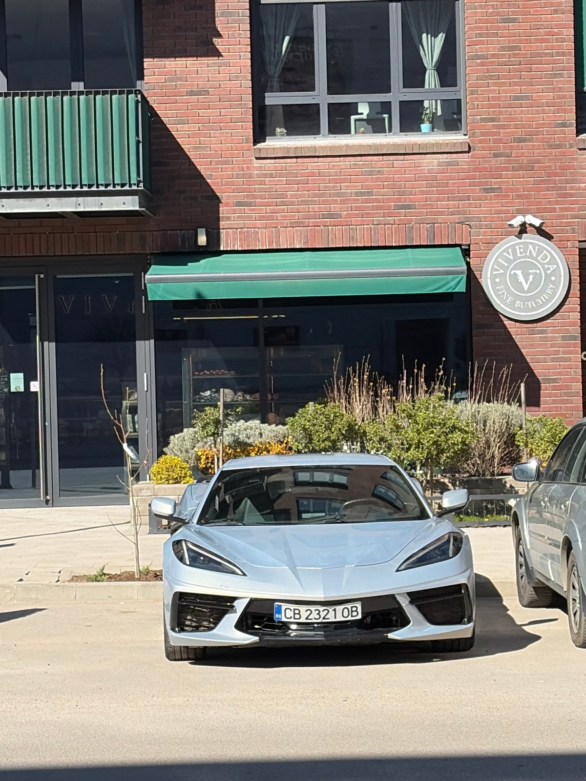 Vehicles parked near Sofia butchery during afternoon hours