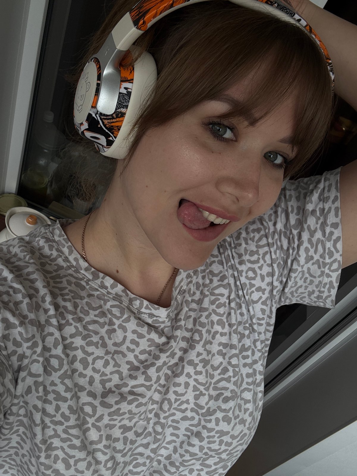 Woman photographs herself in residential Chaikovsky, Russia