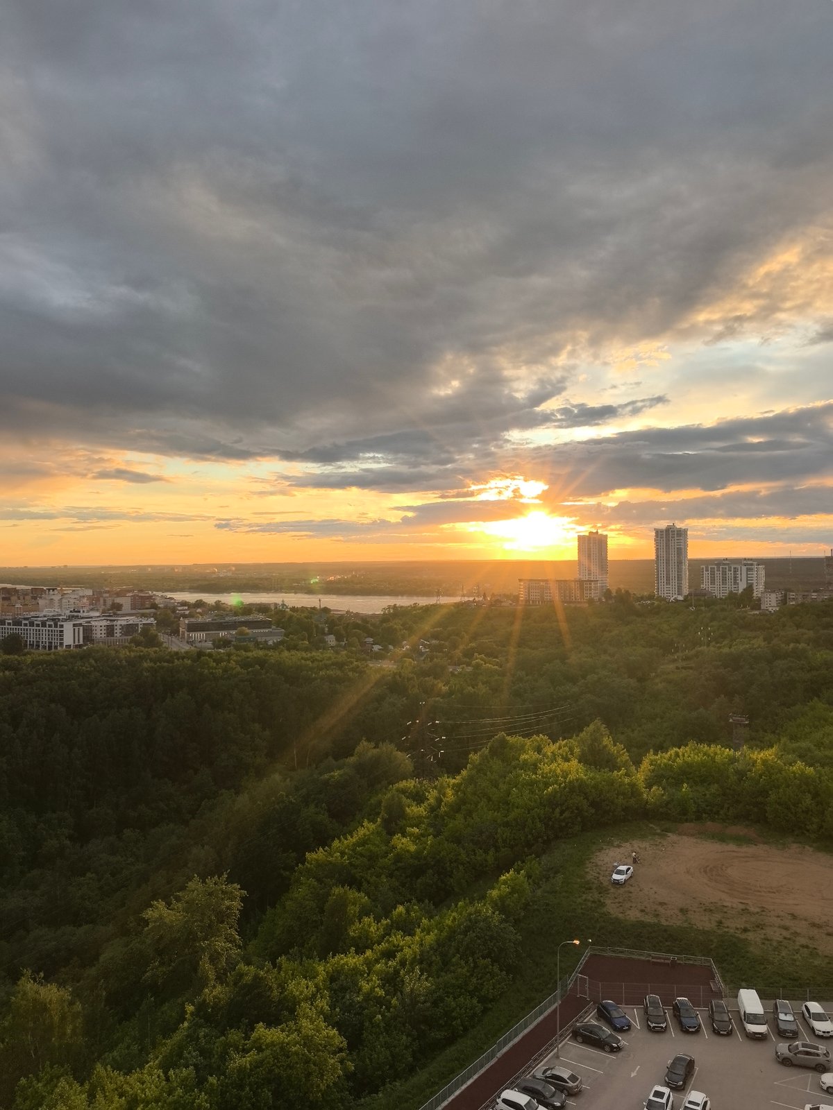 Sunset views captured over Perm, Russia playground and cityscape