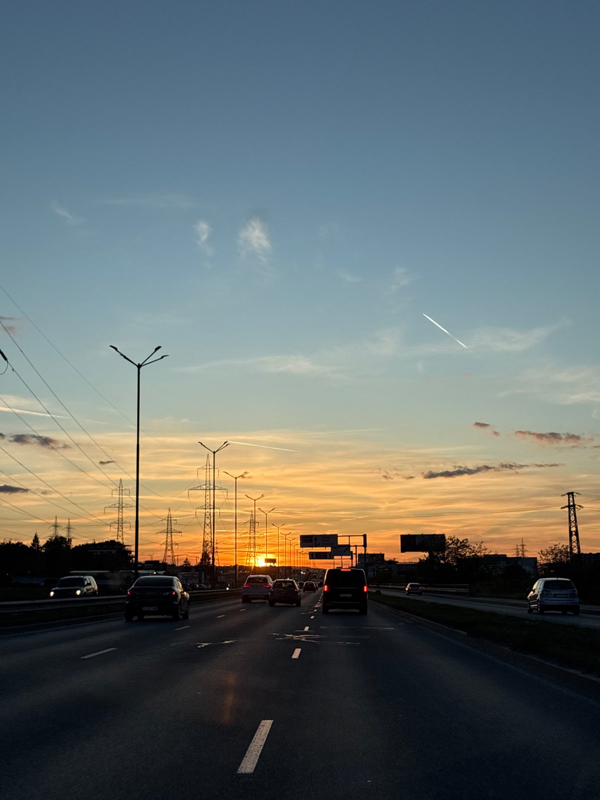 Evening traffic flows through Sofia highway at sunset