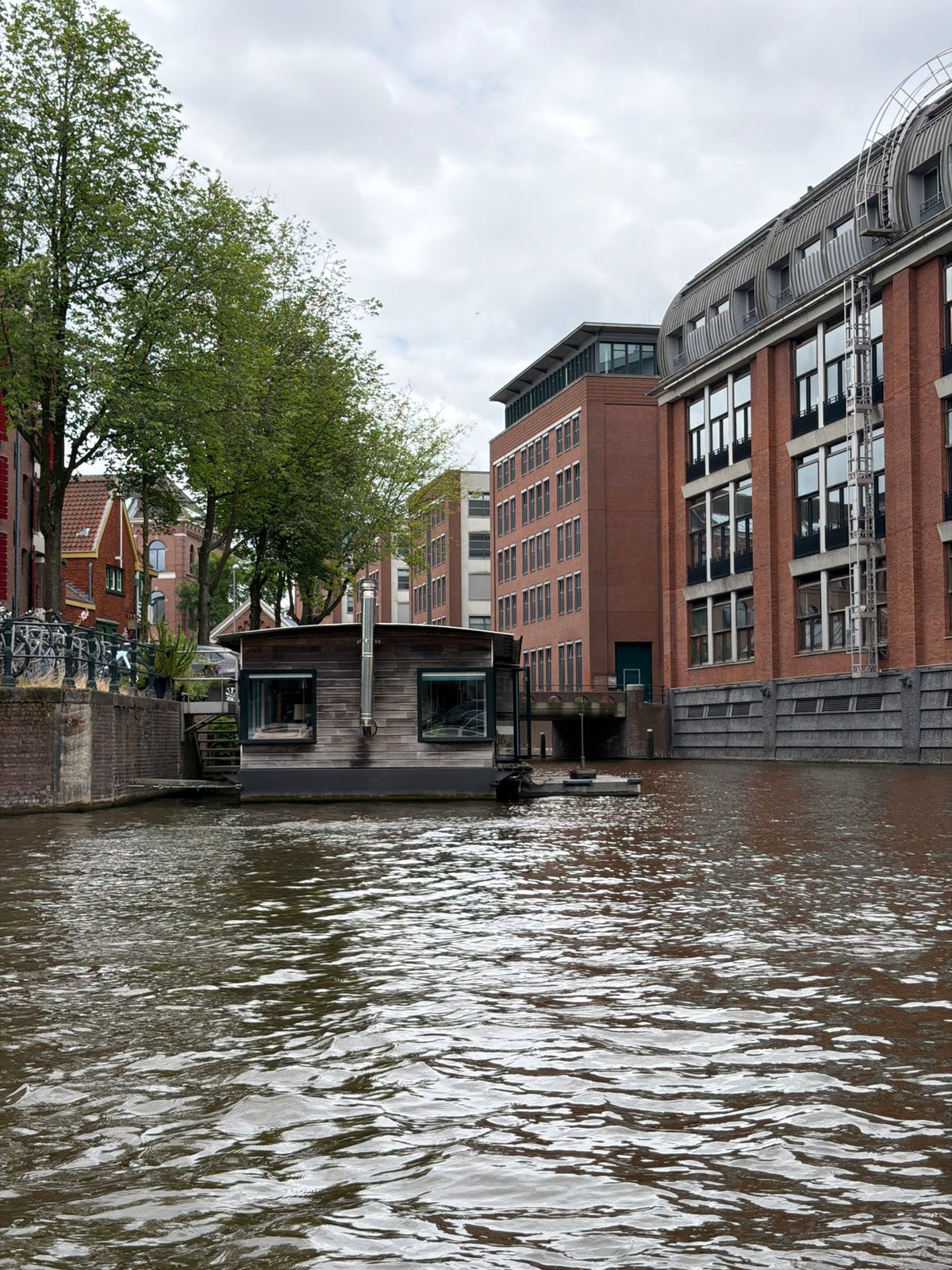 Floating through Amsterdam's canals on a grey summer afternoon