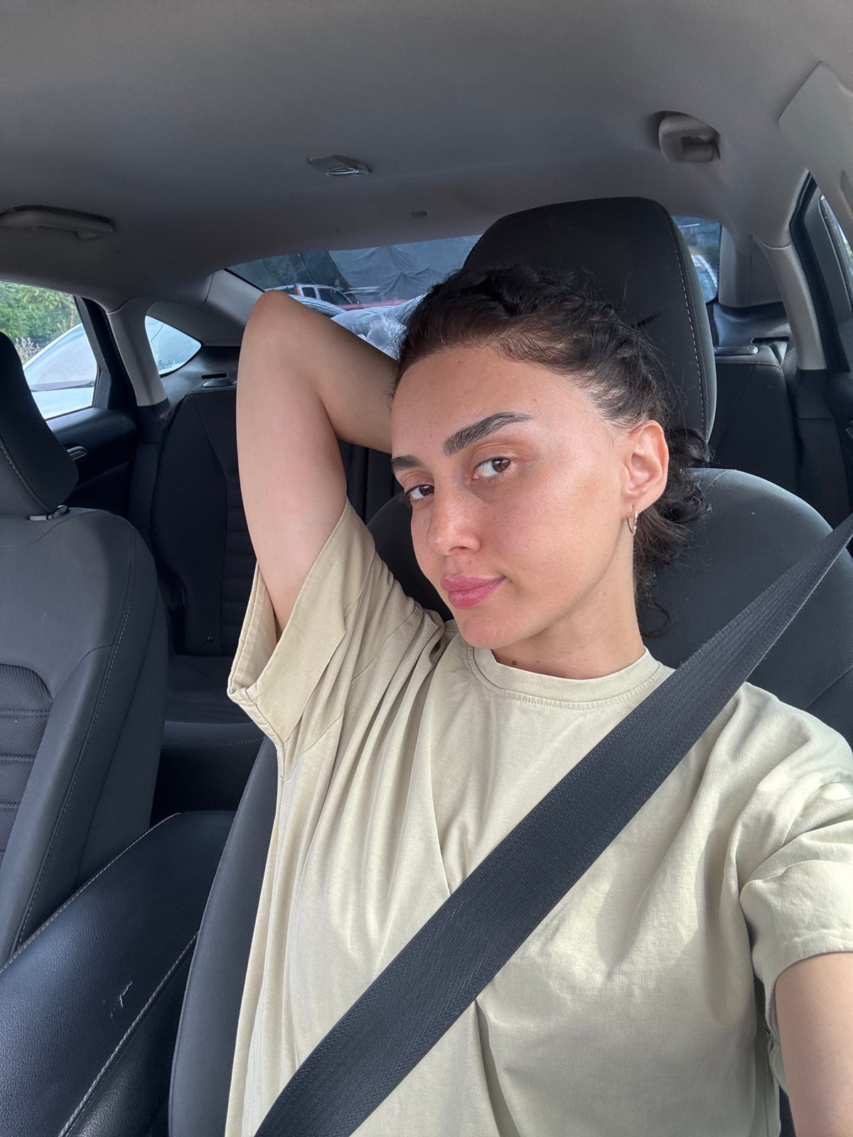 Woman photographed in car during early morning Tbilisi photo session