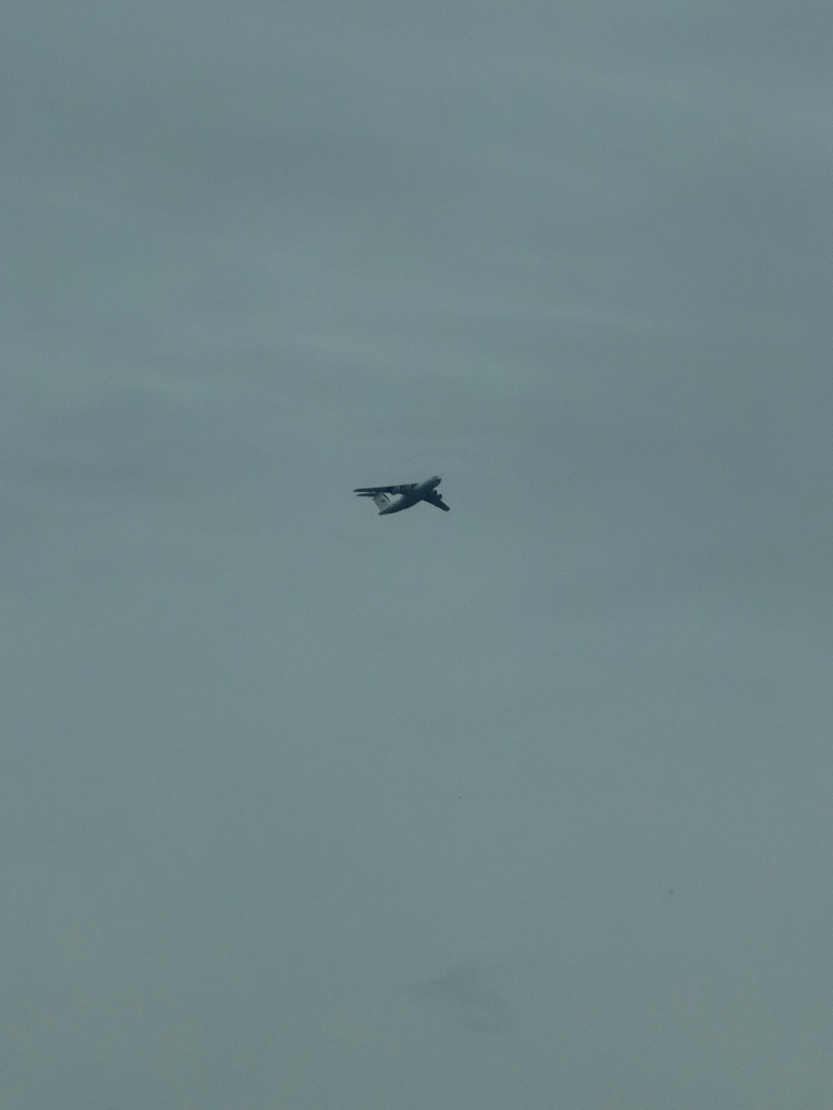 Military jet spotted over Kosoturikha, Russia under overcast skies