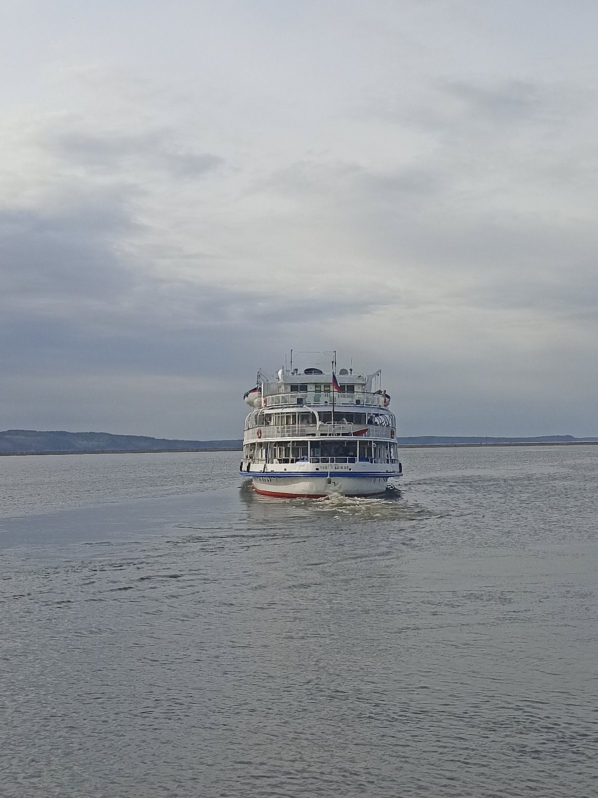 Russian cruise ships observed at waterfront port with passengers