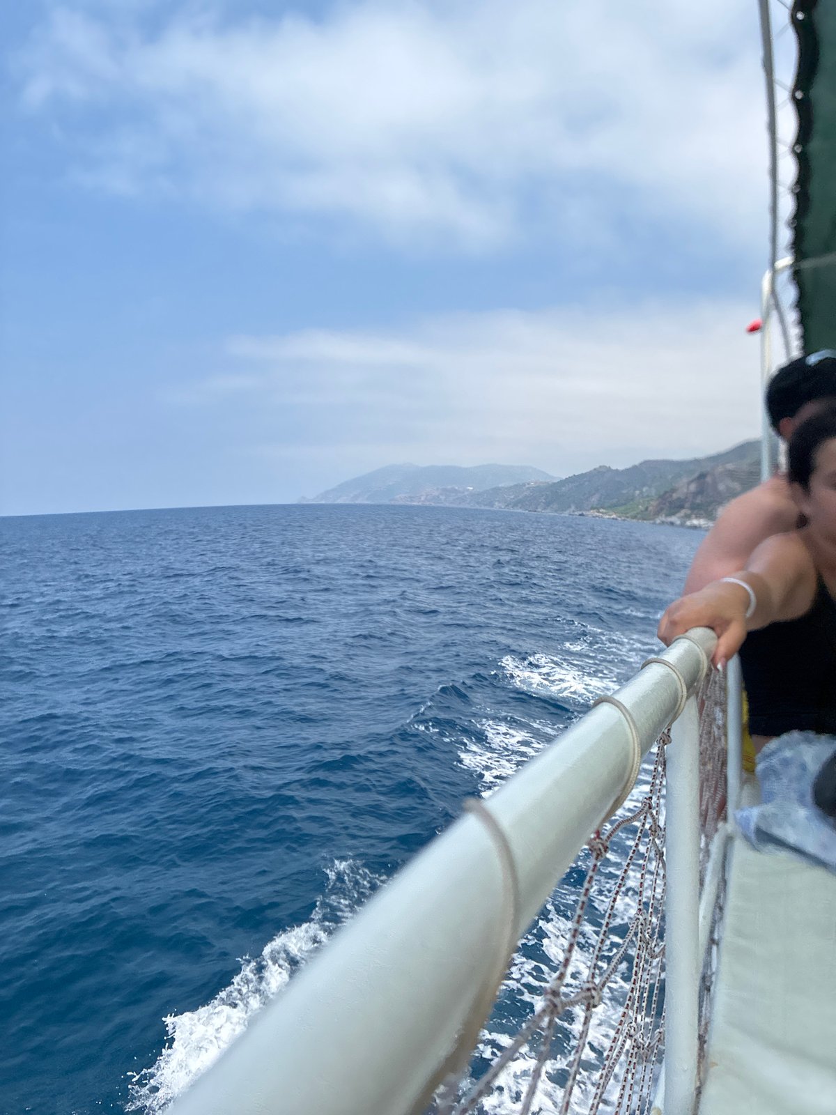 Boating past Gazipaşa's rocky terraced Mediterranean coastline