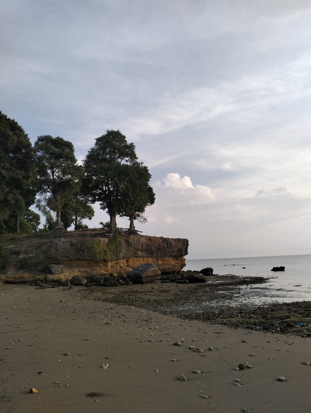 Sunset documented along Indonesian coastline during low tide