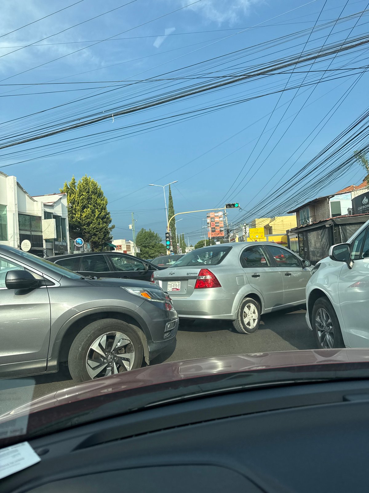 Street scene photographed from vehicle in Puebla, Mexico