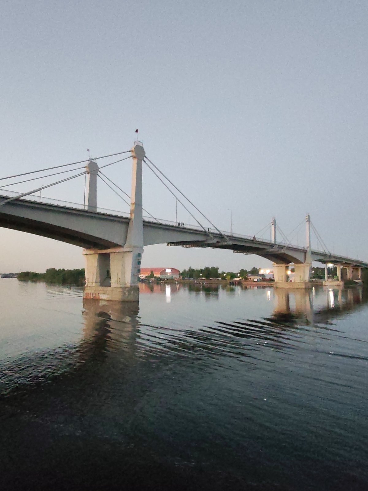 Sunset waterway scenes with bridge and barge documented