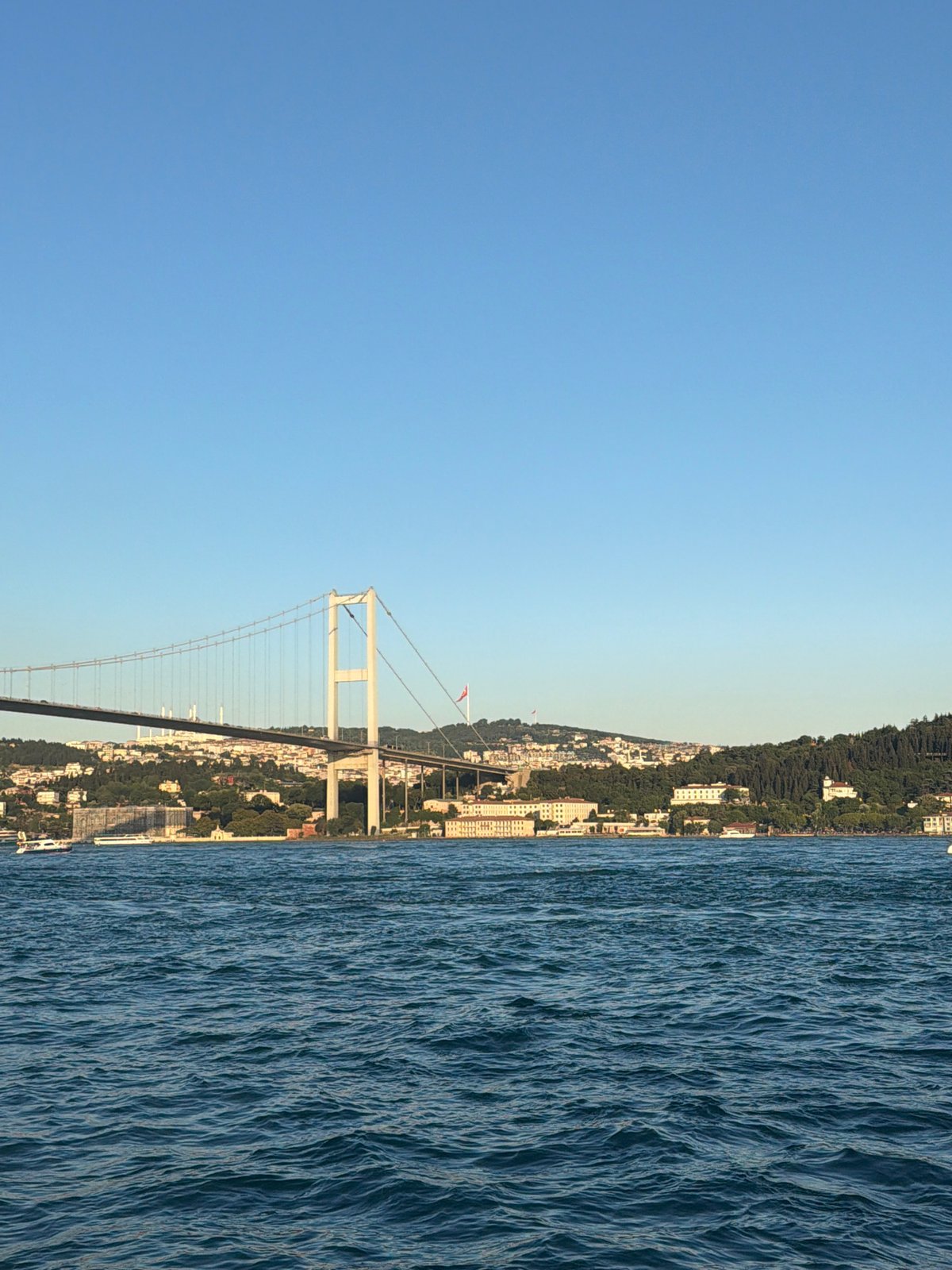 Bosphorus waterfront view with mosque and Fatih Sultan Mehmet Bridge
