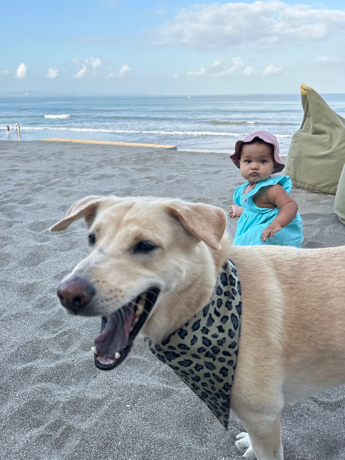 Family beach time on North Kuta's dark sand shores
