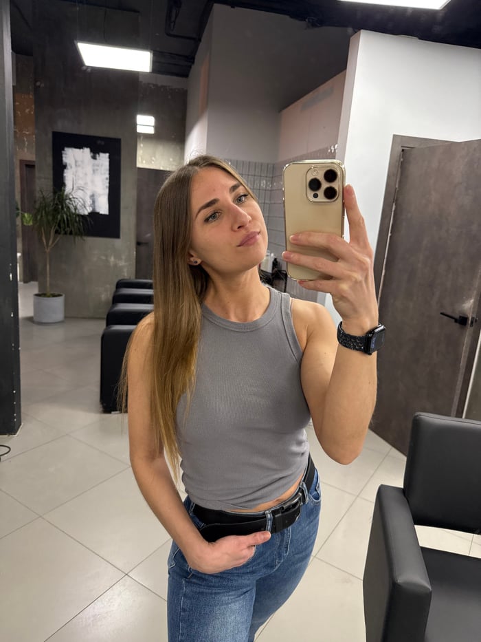 Woman takes mirror selfies at Saint Petersburg salon