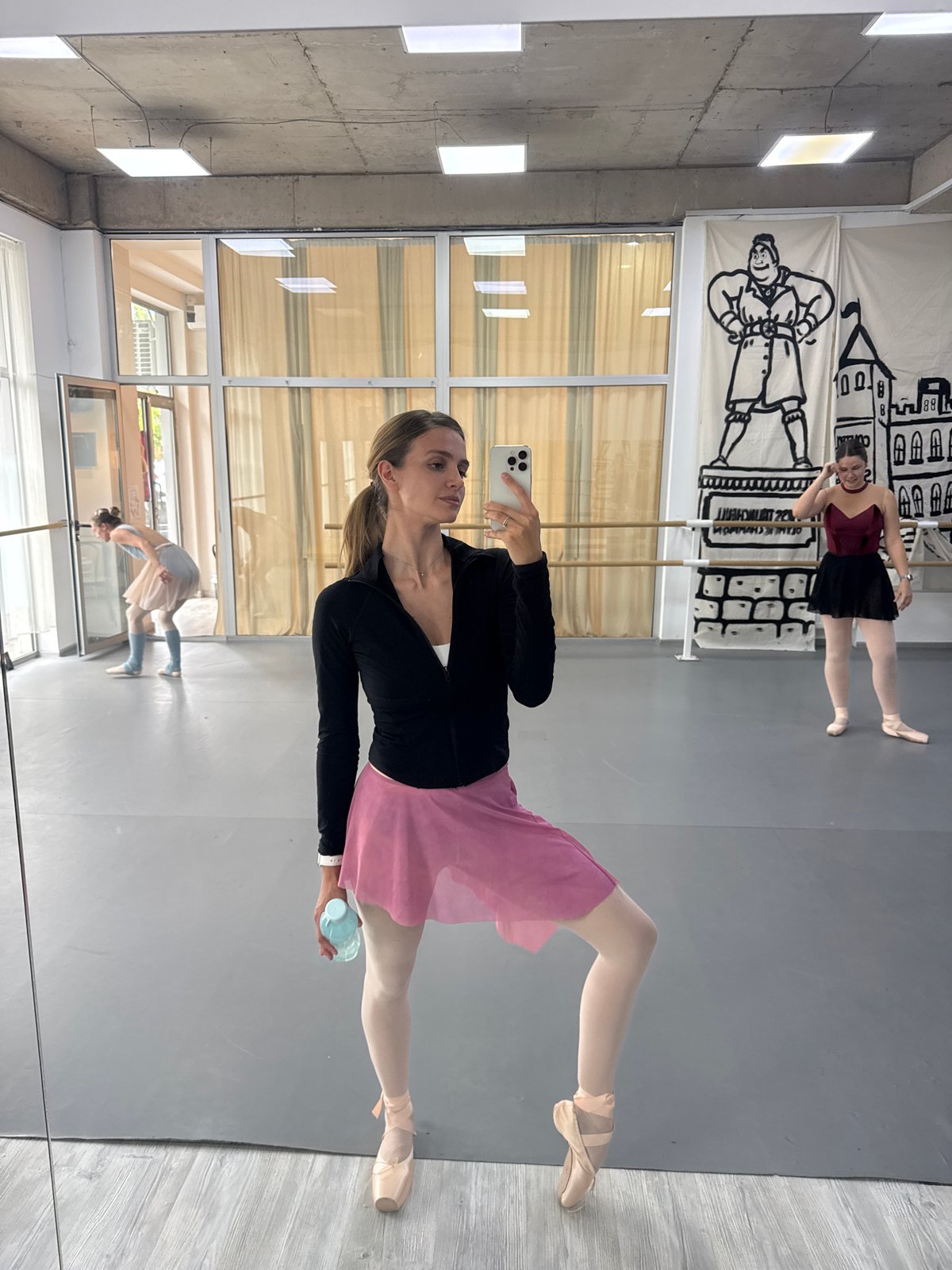 Ballet dancer captures selfies during morning practice in Tbilisi studio