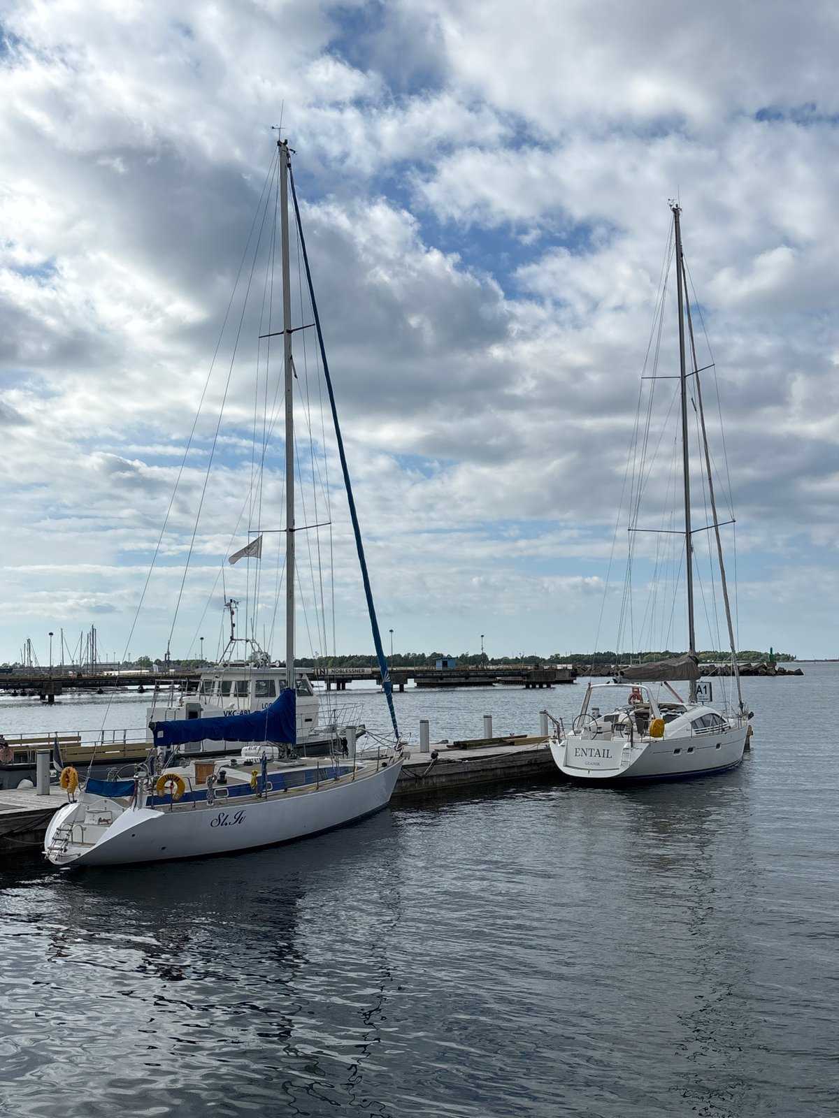 Tallinn maritime museum visitors document ships, harbor activity