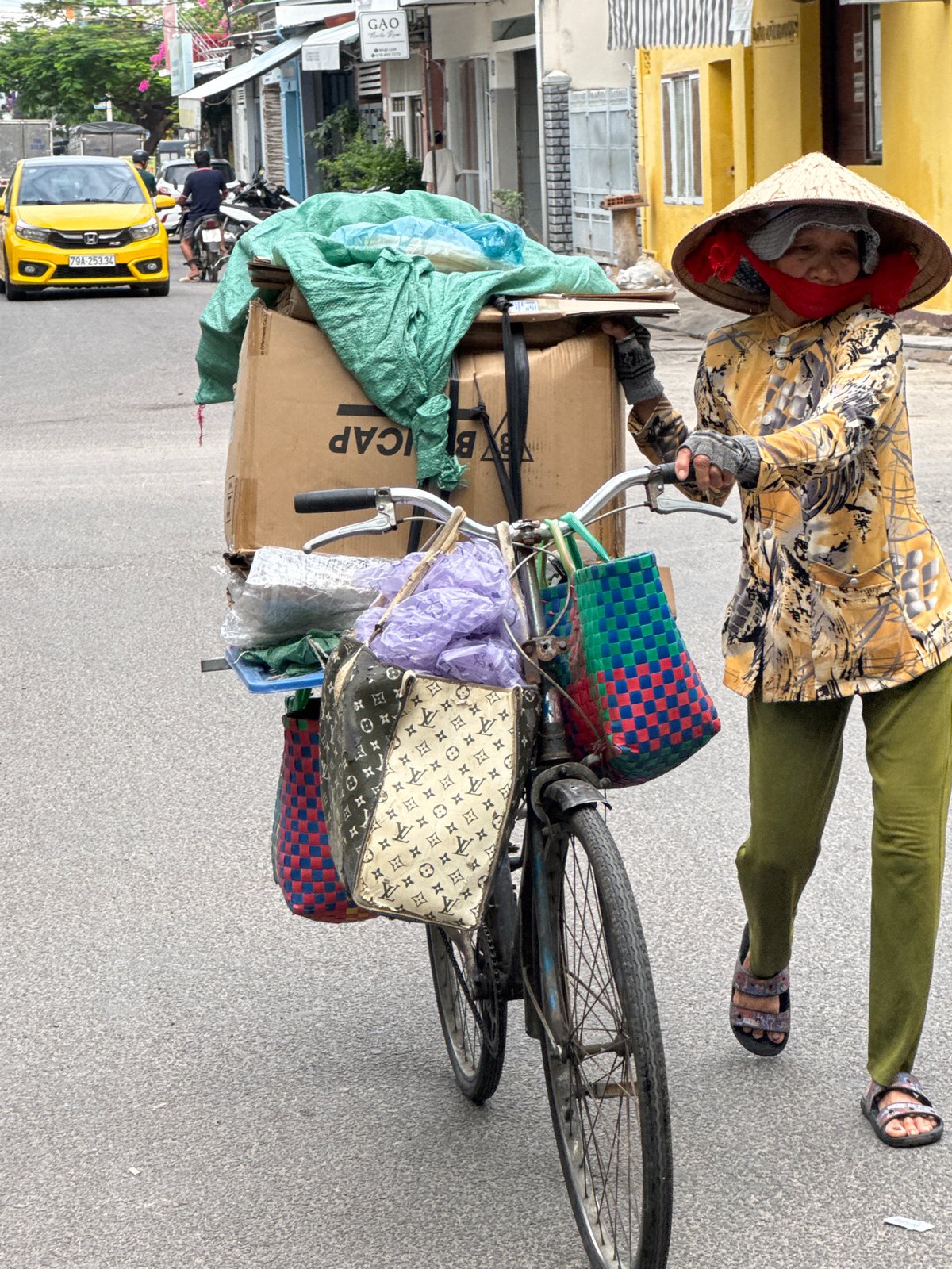 Everyday street scenes from Nha Trang on a cloudy July morning