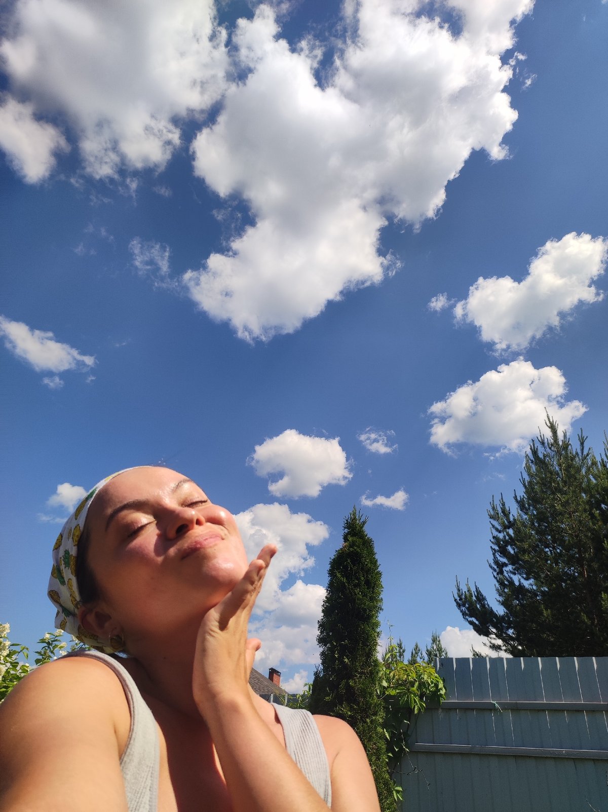 Woman enjoys sunny morning in Russian garden with pond wildlife