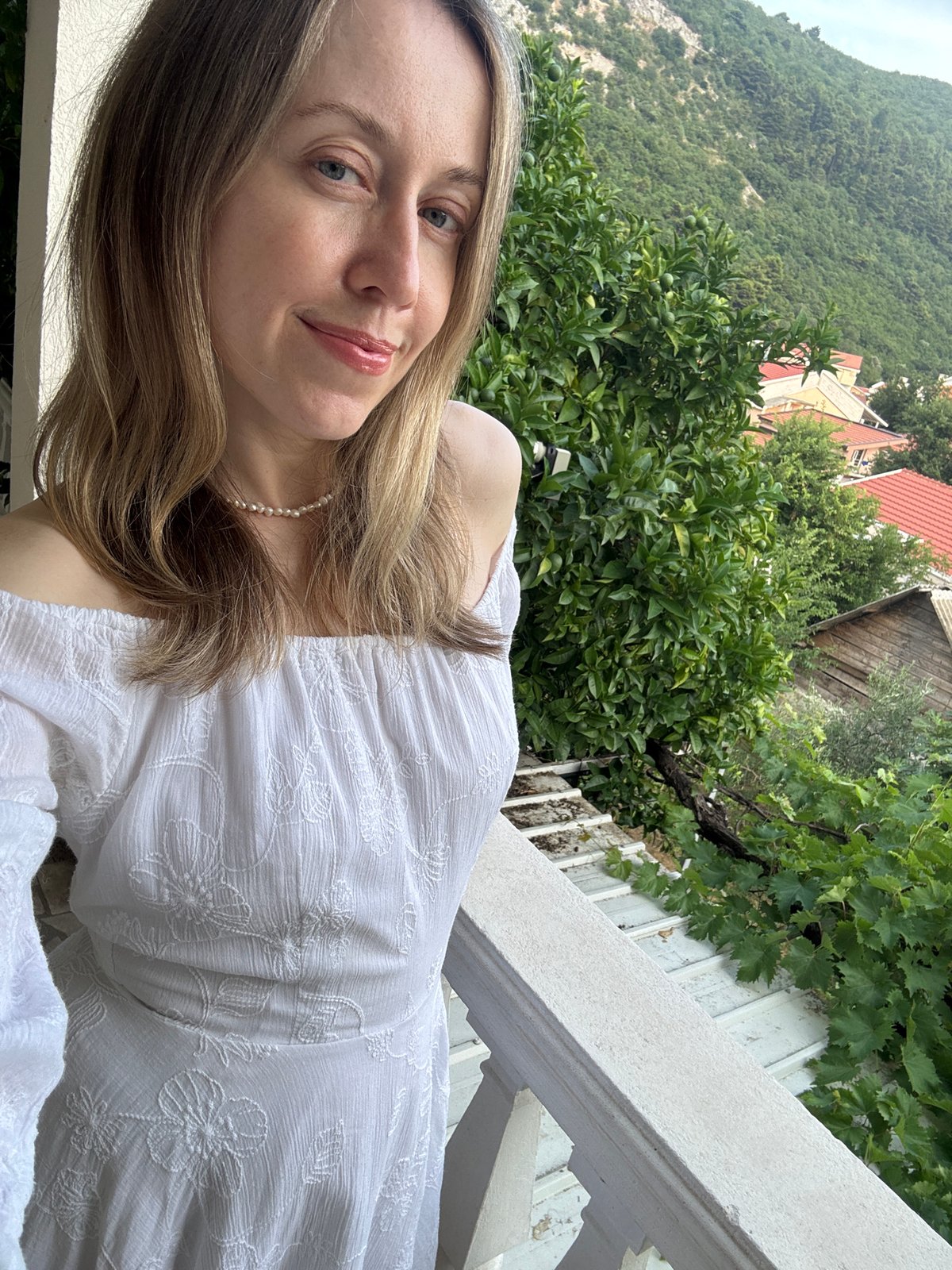 Balcony afternoon in Budva, Montenegro — skies, selfies, and small details