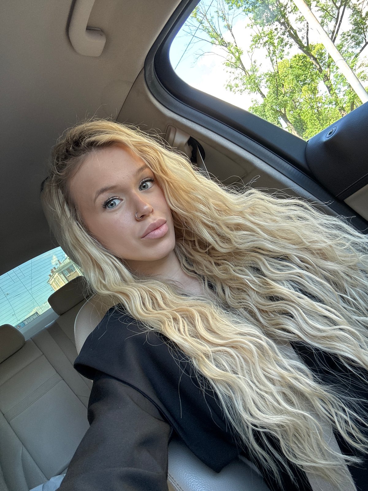 Car selfie session in Saint Petersburg, sunroof open