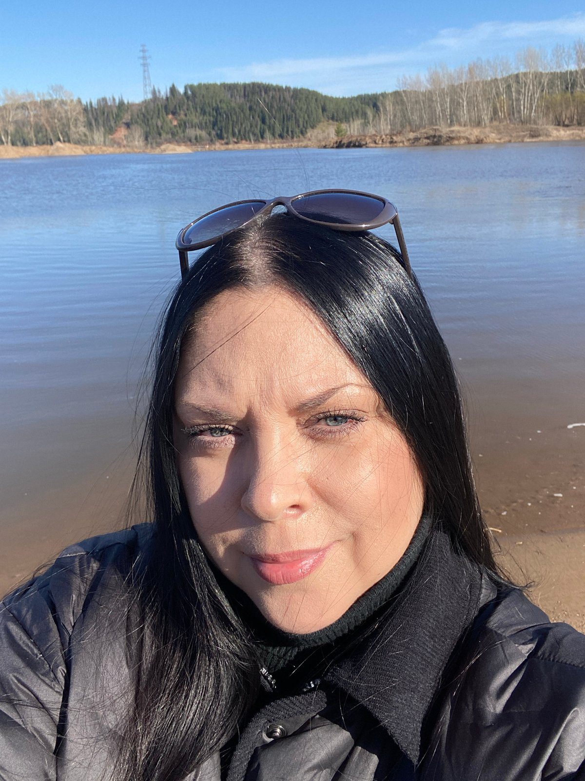 Woman photographed during waterfront outing in Noviy, Russia