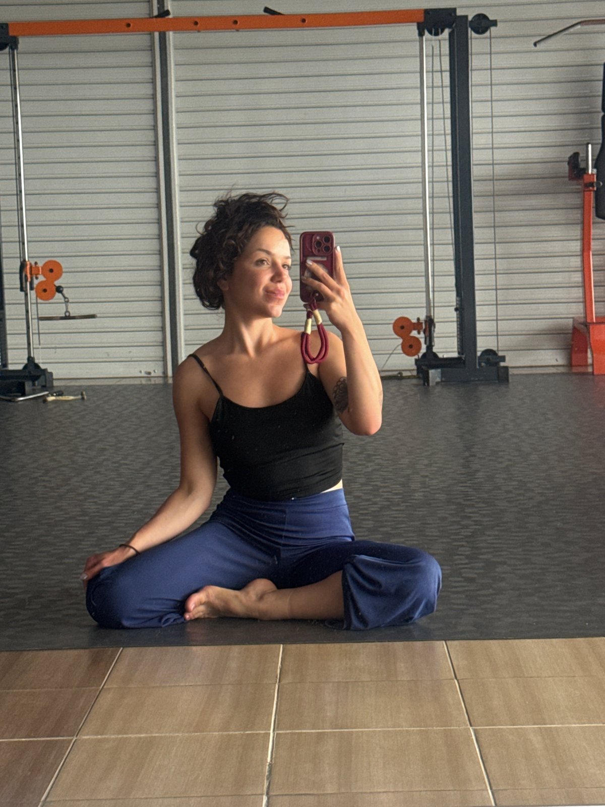 Meditative selfie on a yoga mat in a Burgas gym.