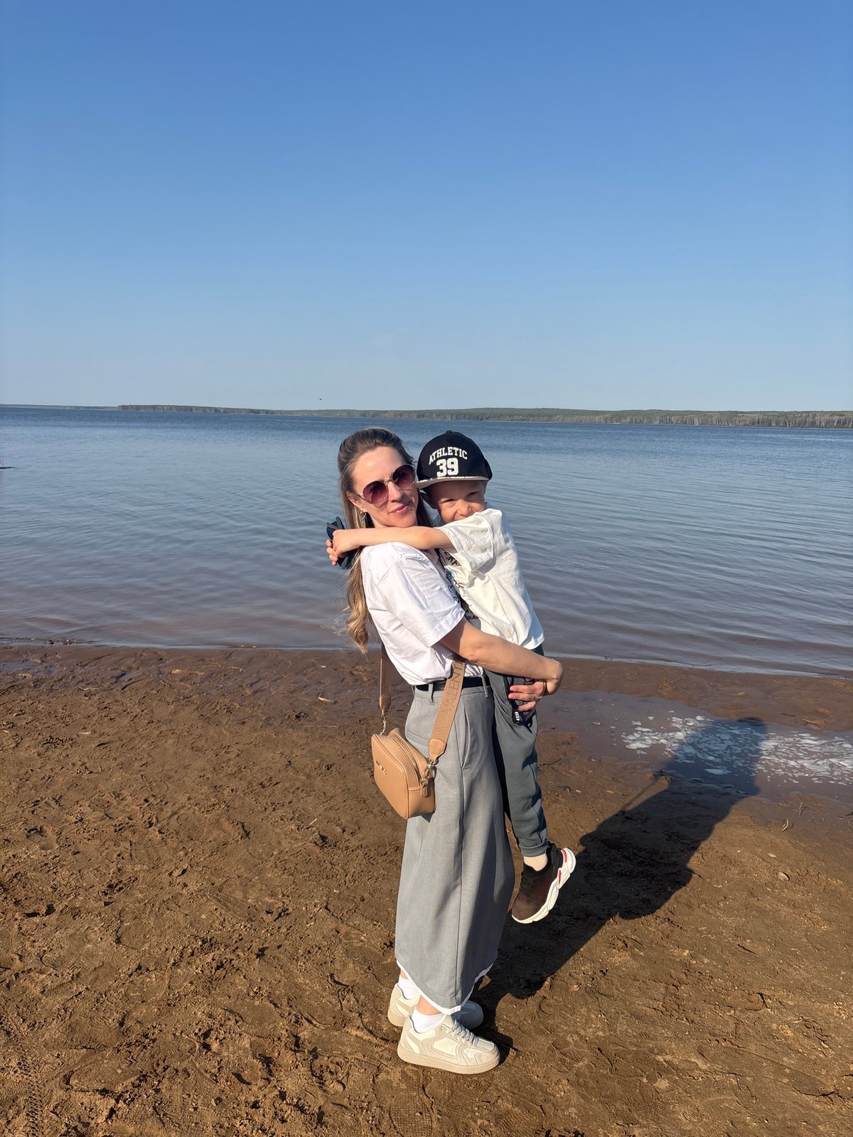 Families enjoy sunny afternoon at Chaikovsky beach along Kama River