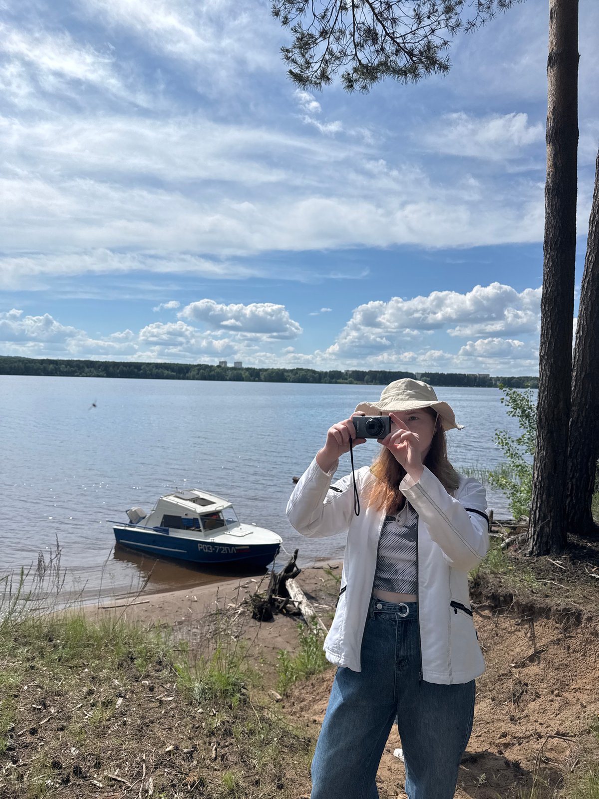 Woman documents nature outing along Kama River near Chaikovsky