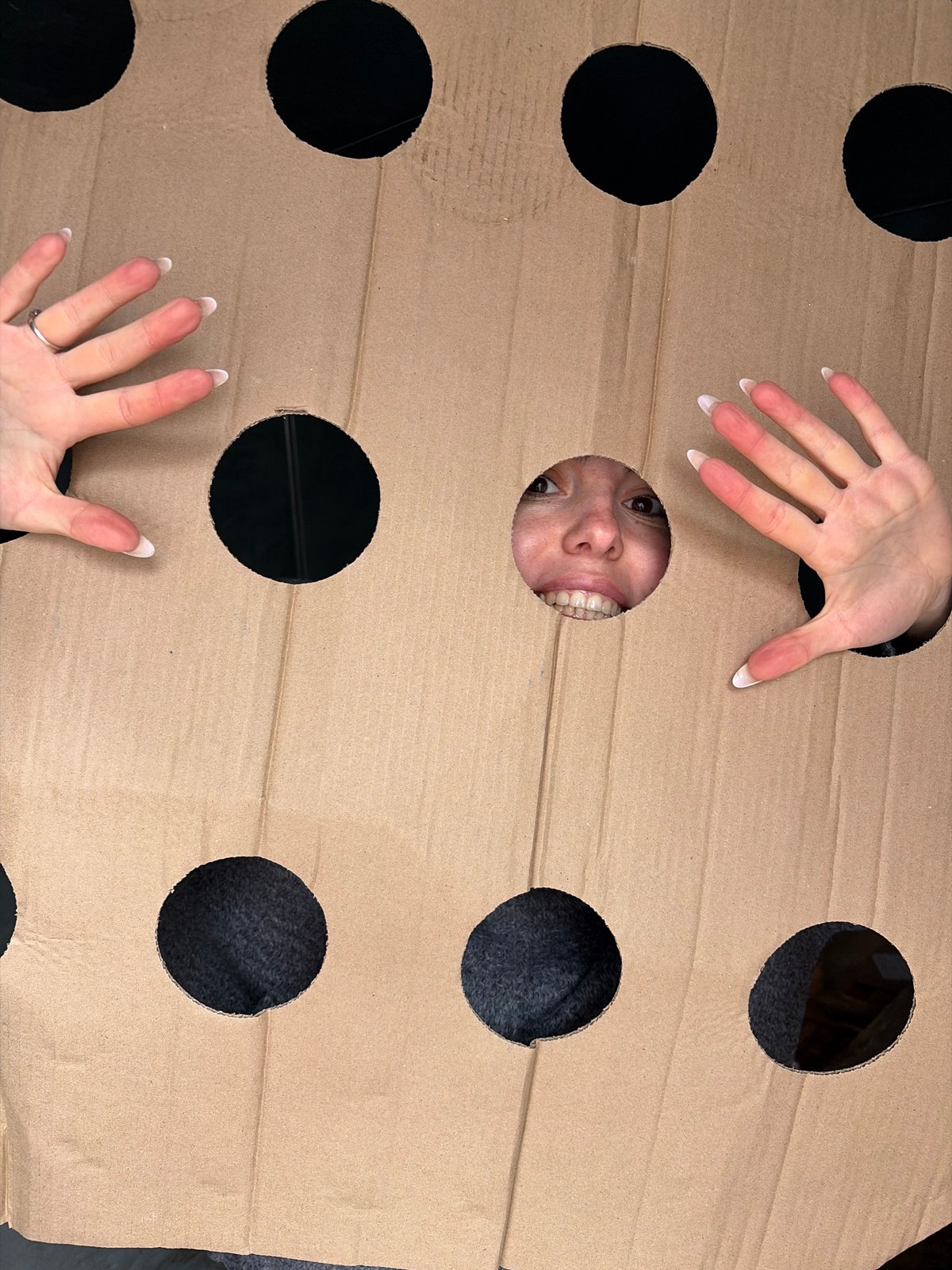 Woman plays with cardboard cutout in Izhevsk