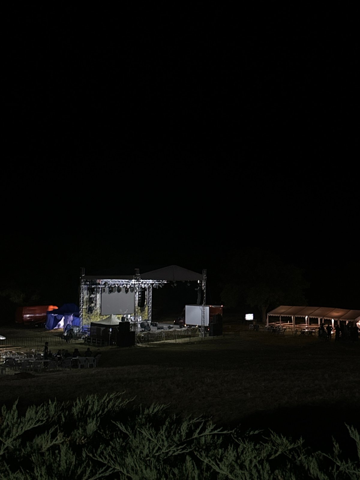 Outdoor stage and lighting rig set up for night event in Shumen