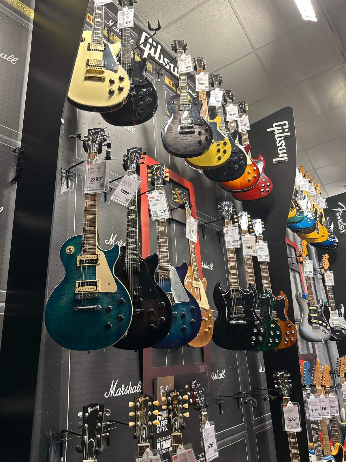 Music store guitar display photographed in Fort Myers