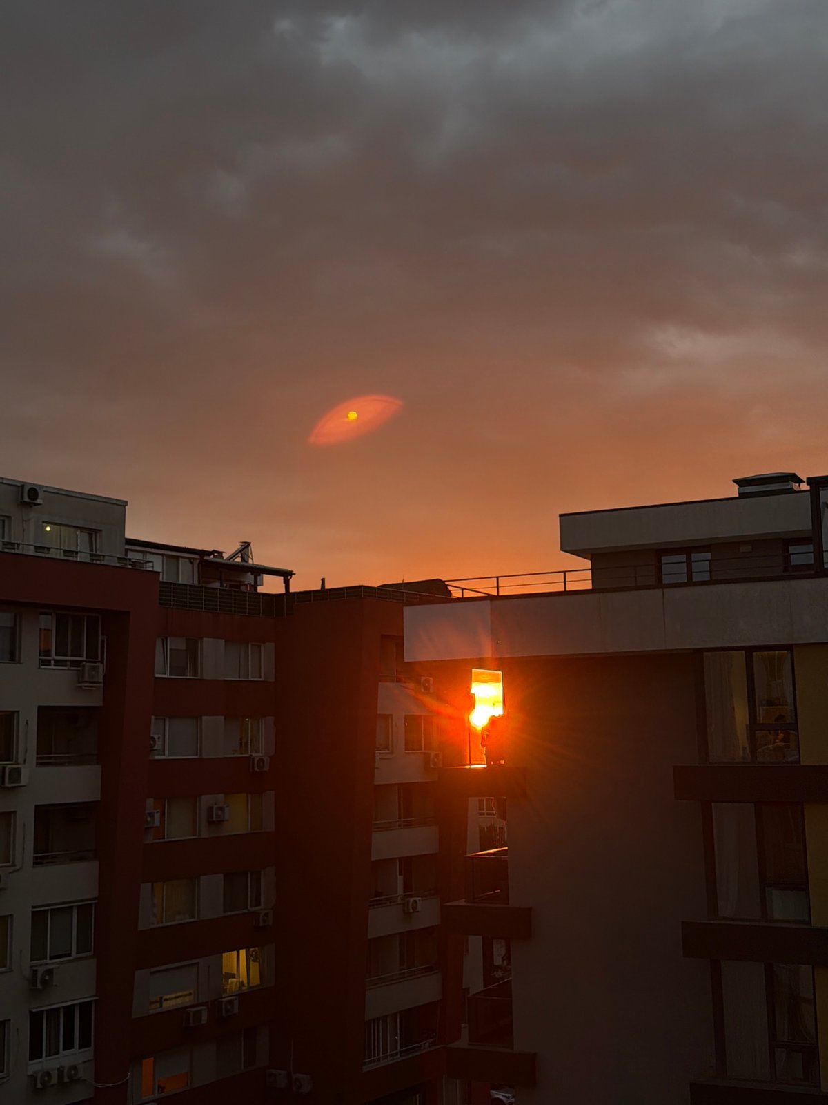 Dramatic sunset illuminates Sofia skyline with vibrant colors