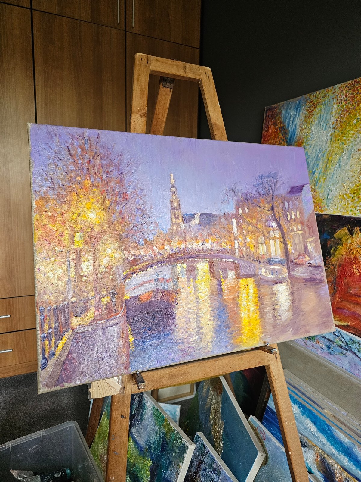 Post-impressionist painting captures nighttime Plovdiv cityscape with warm lighting