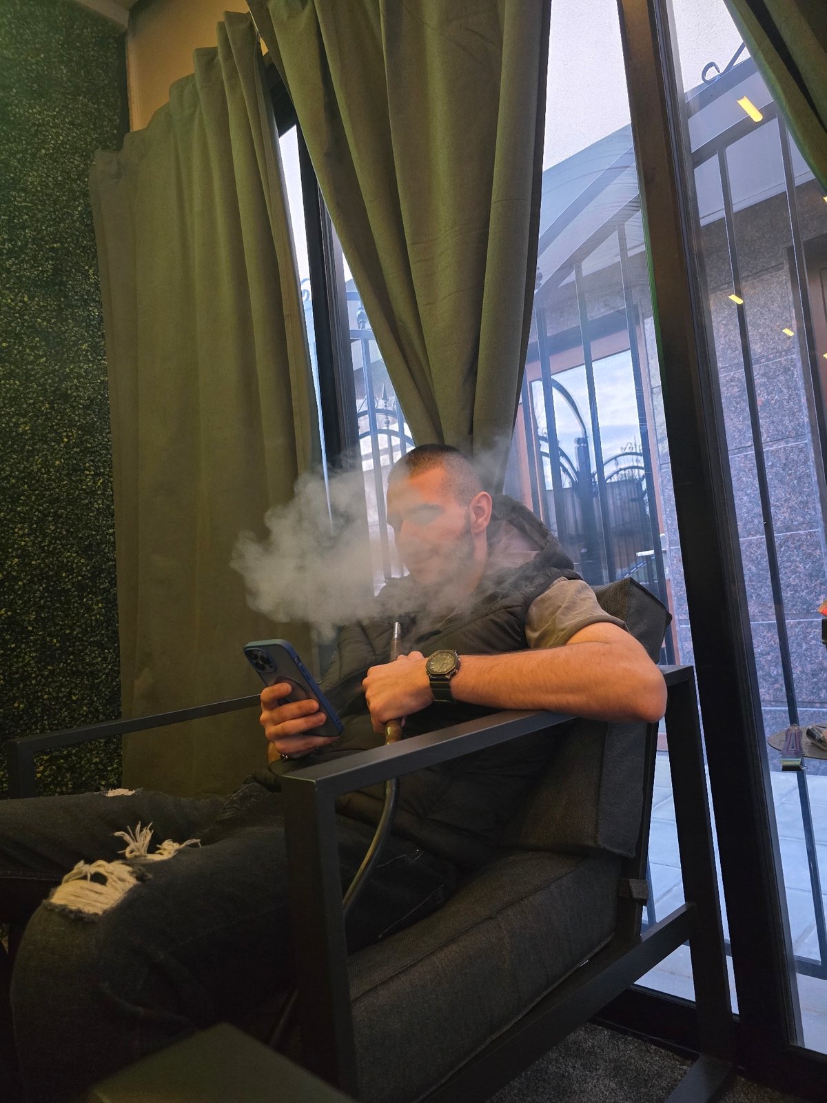 Man photographed in Sofia cafe and bathroom selfie