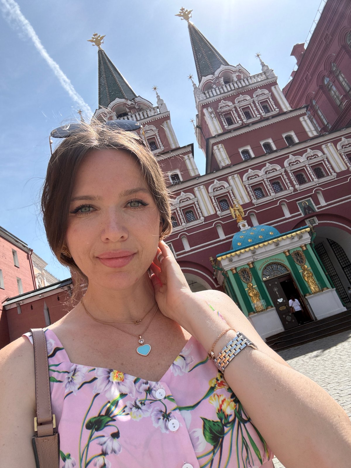 Tourist photographs herself at Moscow's Red Square landmarks