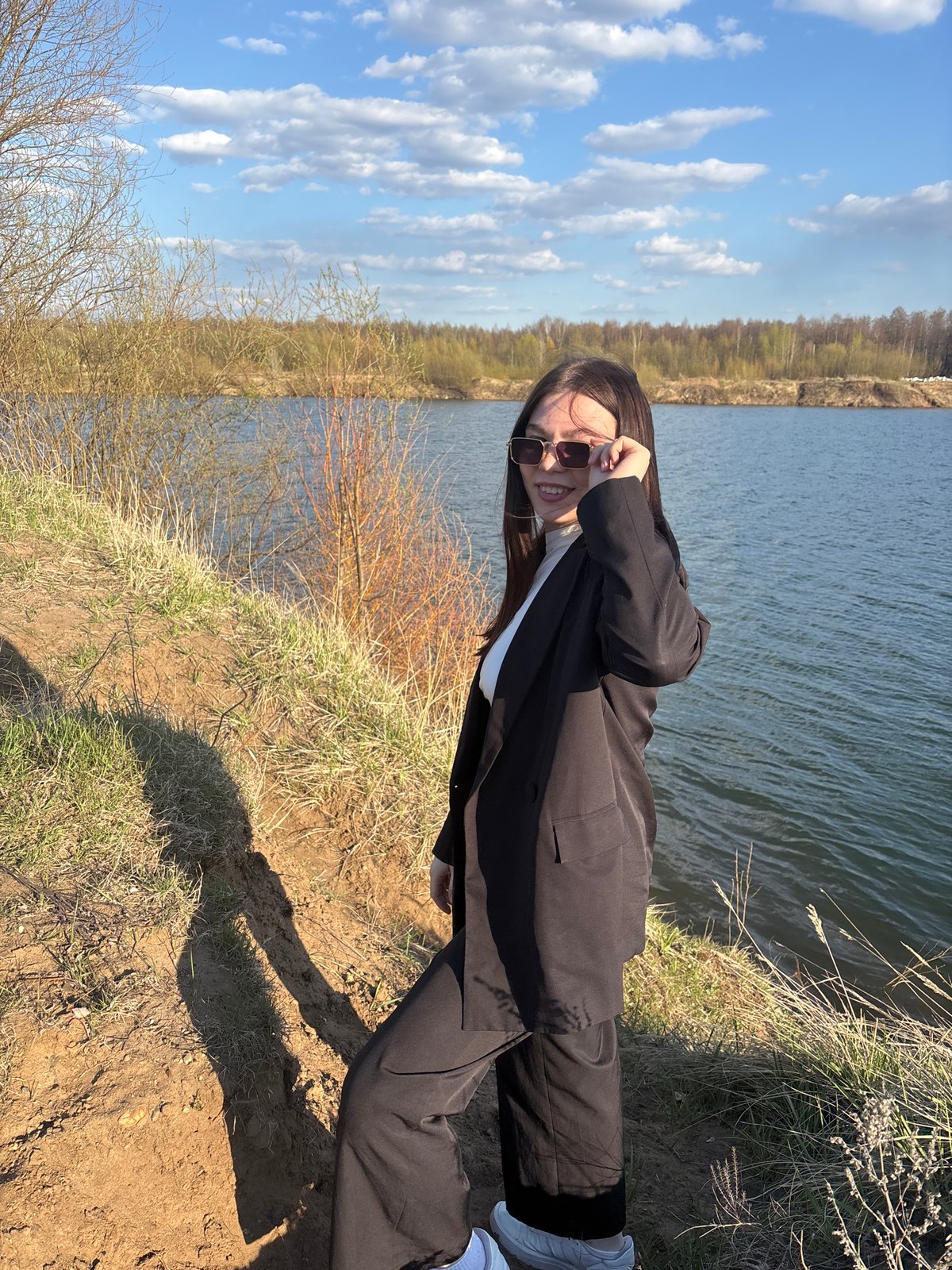 Woman poses for photos by lake in Zaosinovo Russia